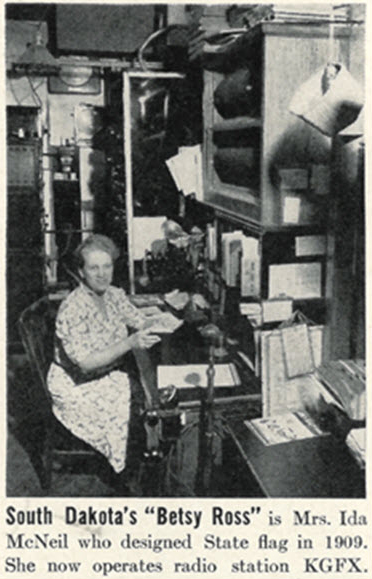 Newspaper clipping of Ida McNeil with the original flag